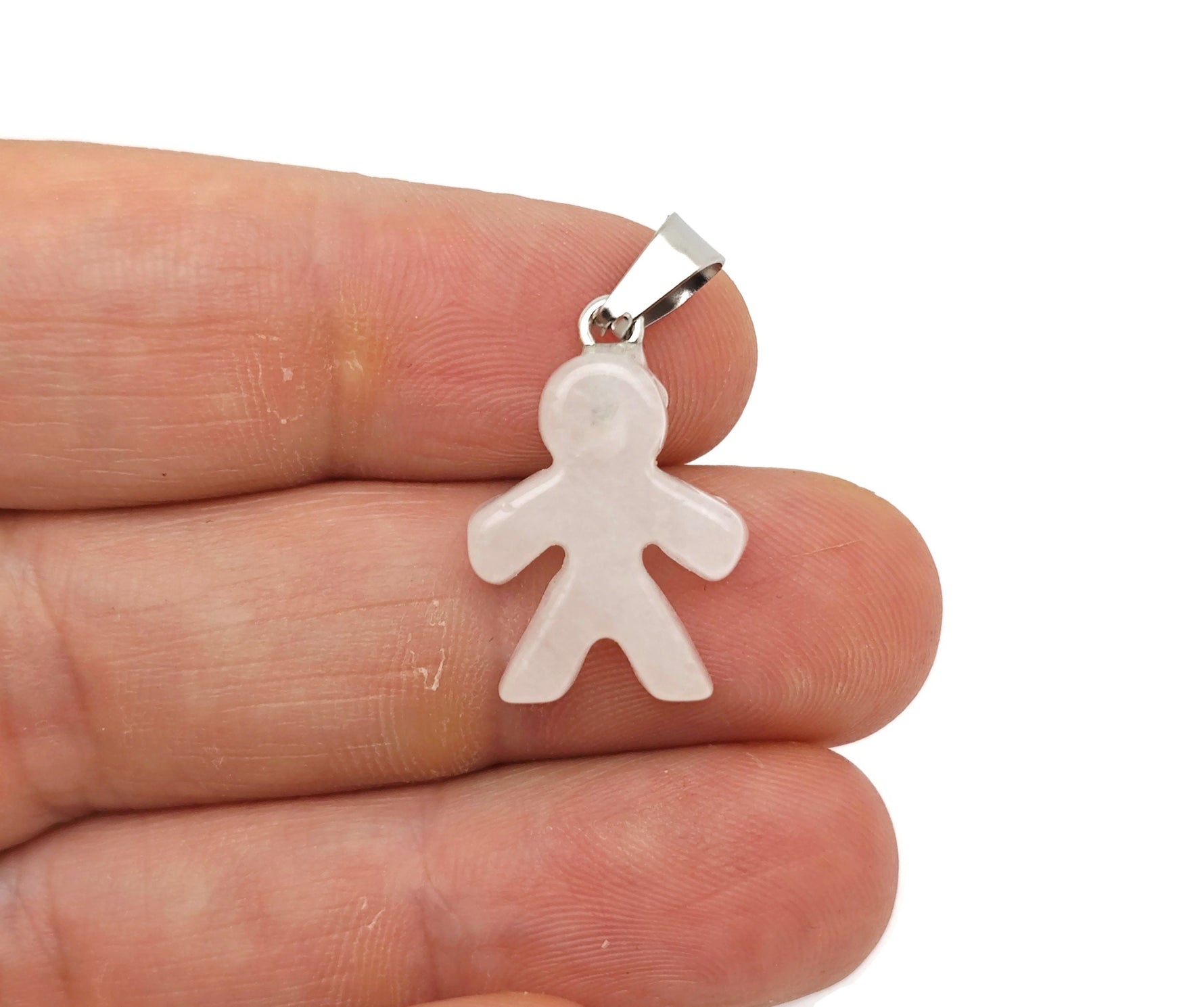 Clear quartz gingerbread cookie-shaped crystal pendant from GemstoneGO, showcasing a detailed mineral specimen with transparent quartz.