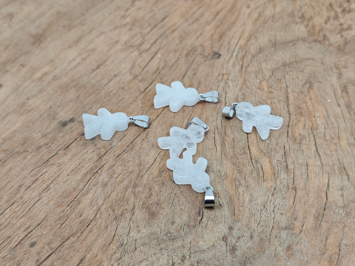 Clear quartz gingerbread cookies men crystal pendant with mineral specimens, featuring intricate gemstone details from GemstoneGO.