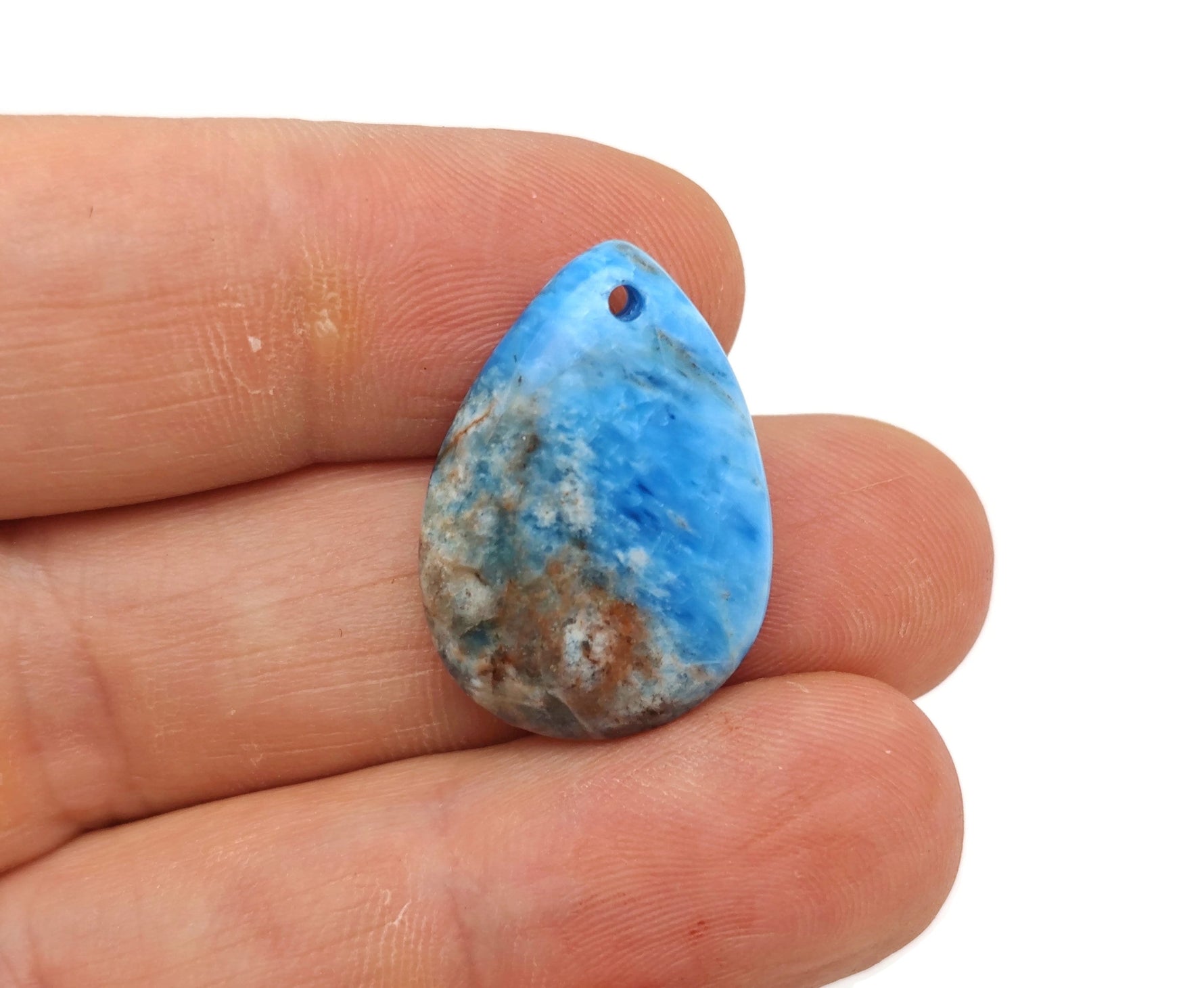 Blue Apatite dainty drop crystal pendant for DIY jewelry making, featuring a polished blue gemstone and delicate silver setting.