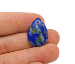 Dainty lapis lazuli crystal pendant with gold-toned setting, suitable for DIY jewelry making, showcased against a neutral background.