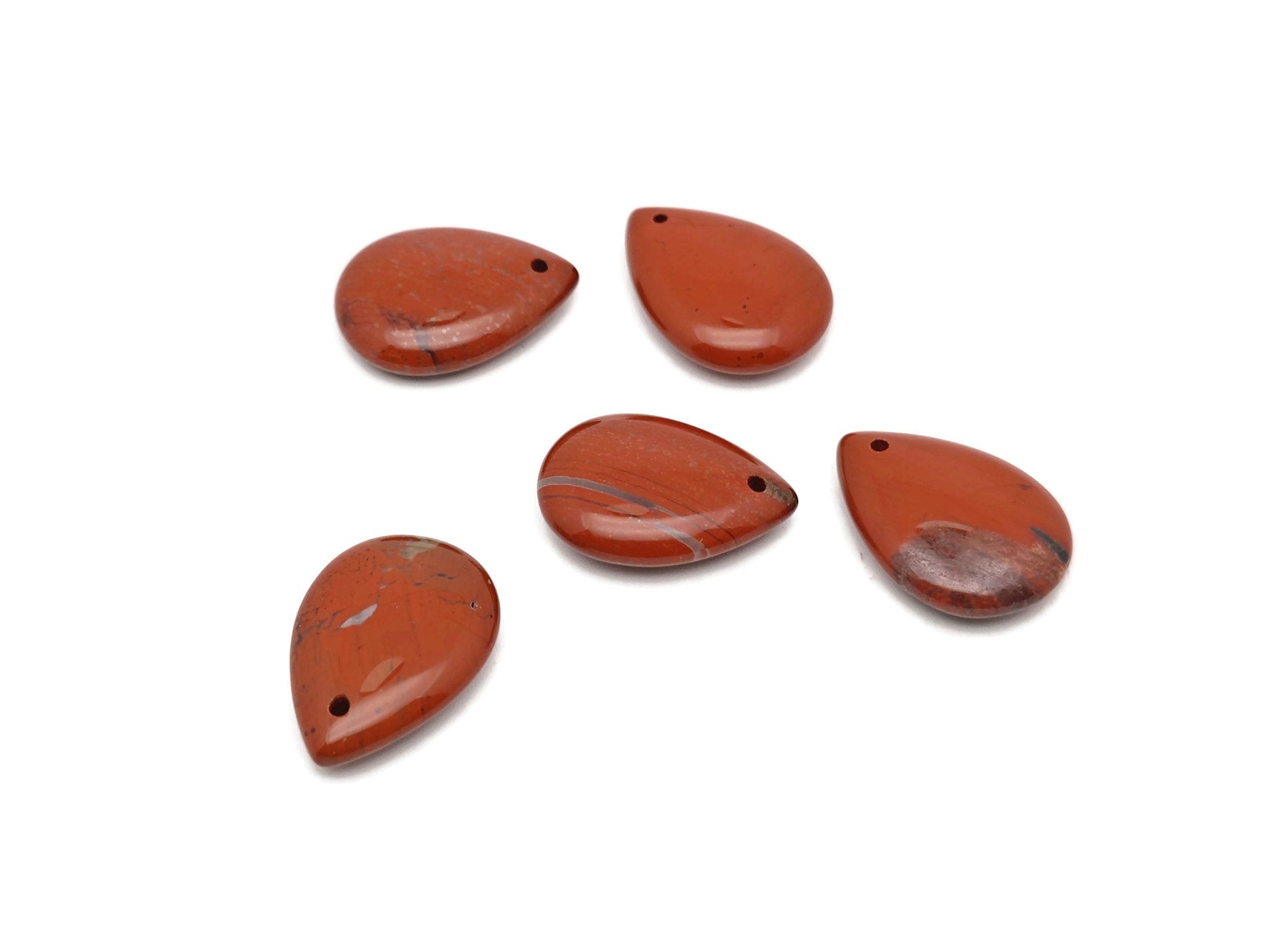Red Jasper dainty drop crystal pendant from GemstoneGO, perfect for DIY jewelry making, featuring a polished red jasper stone and delicate design.