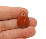 Red Jasper dainty drop crystal pendant for DIY jewelry making, featuring a polished red jasper stone and delicate silver chain.