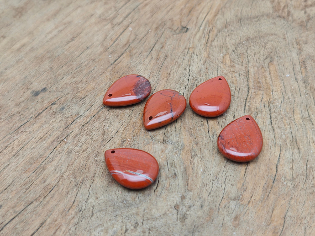 Red Jasper dainty drop crystal pendant by GemstoneGO, suitable for DIY jewelry making, featuring a polished red jasper stone and delicate design.