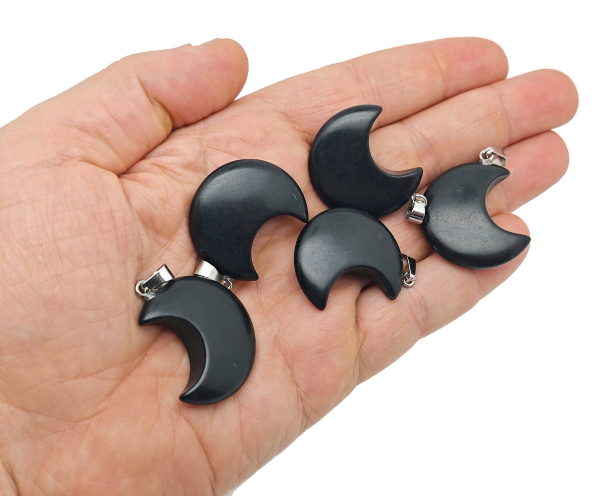Obsidian Moon gemstone pendant featuring a crescent moon design, crafted by GemstoneGO, showcasing a polished black stone pendant.