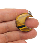 Tiger Eye moon gemstone pendant featuring a crescent moon design from GemstoneGO, showcasing warm, polished tiger eye stone.