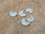 Clear quartz moon gemstone pendant featuring a crescent moon design from GemstoneGO, showcasing a polished, luminous stone on a silver chain.