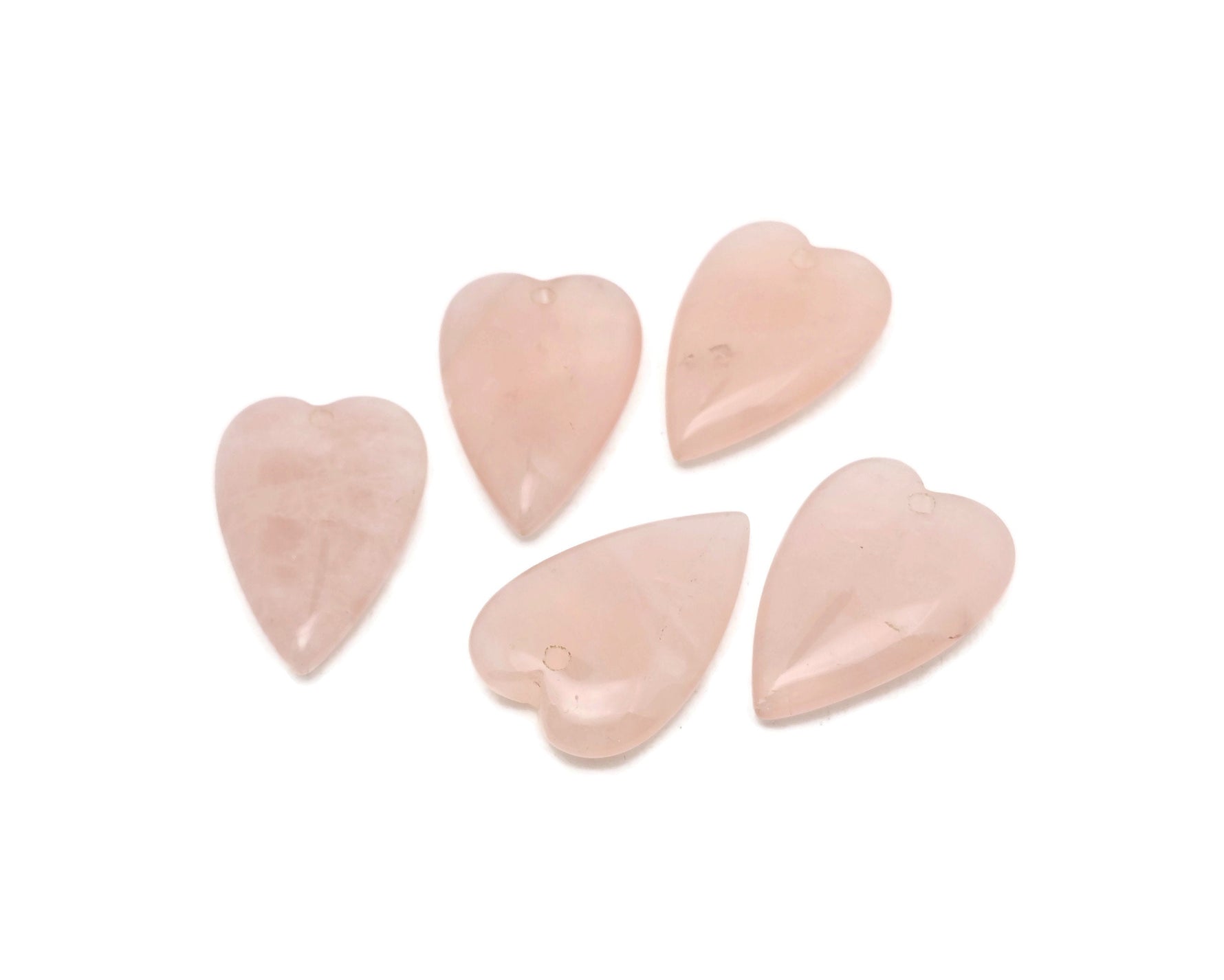 Heart-shaped rose quartz love crystal pendant with a polished gemstone, showcasing a delicate pink hue and smooth finish.