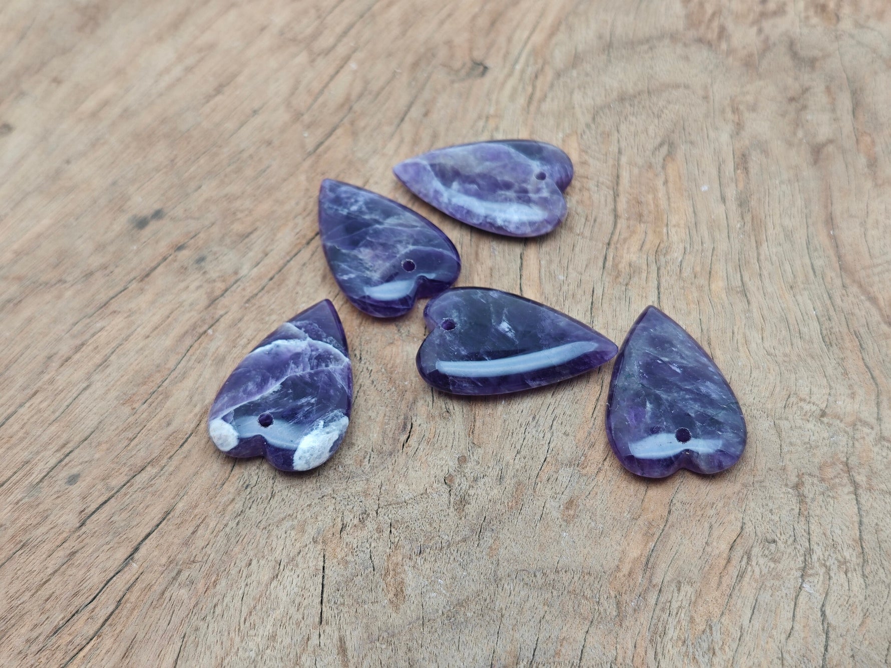 Amethyst long heart-shaped love crystal pendant with a gemstone healing gemstone, featuring a silver chain and purple hue.