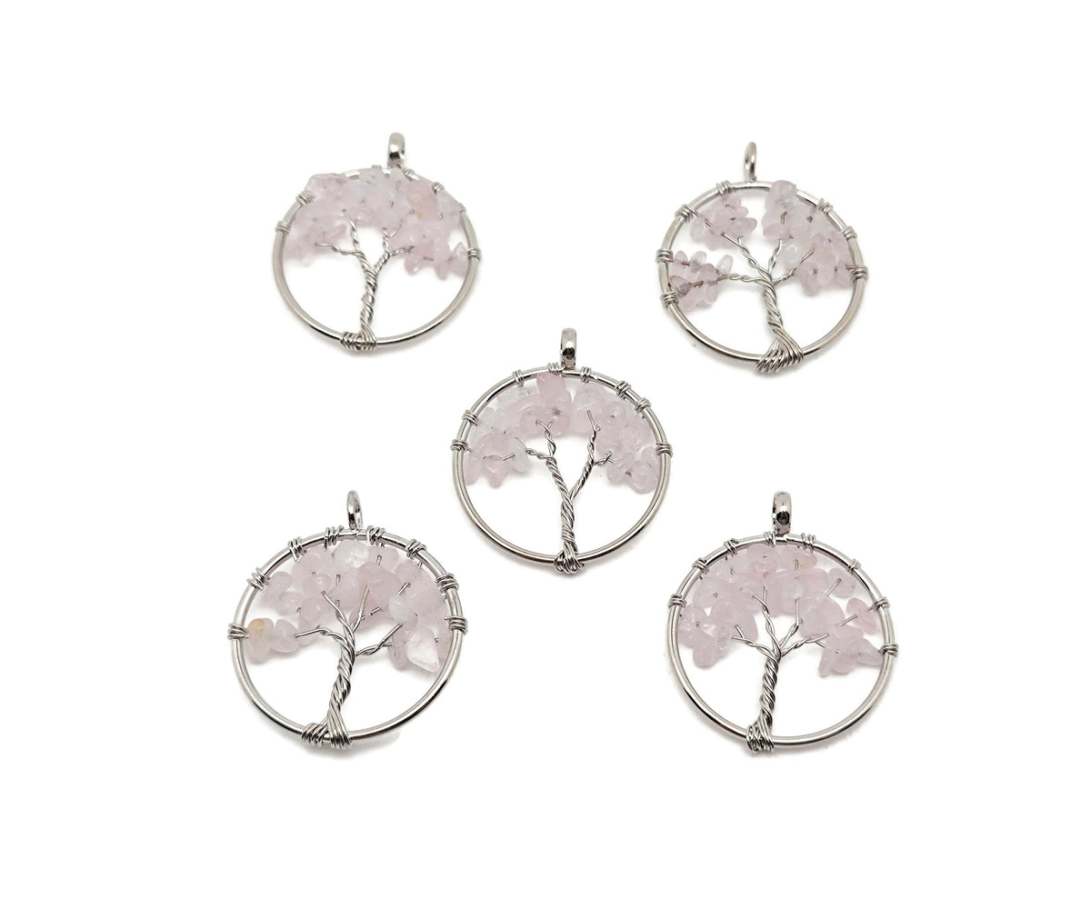 Rose quartz Tree of Life gemstone pendant from GemstoneGO, showing the intricate crystal gemstone design on a silver-toned pendant.