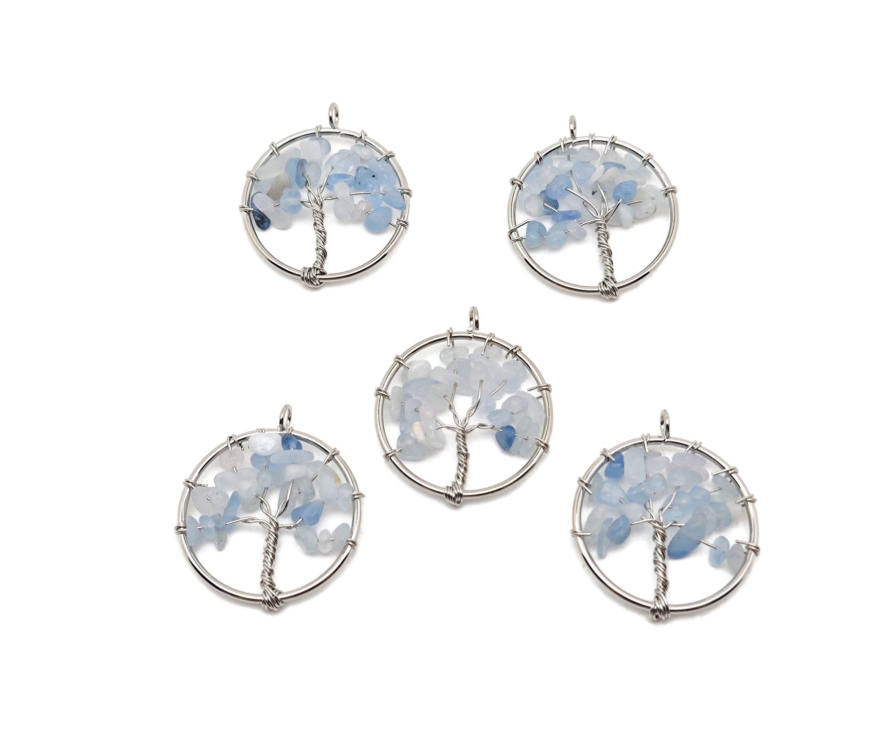 Aquamarine Tree of Life gemstone pendant from GemstoneGO featuring a detailed crystal and metal tree design.