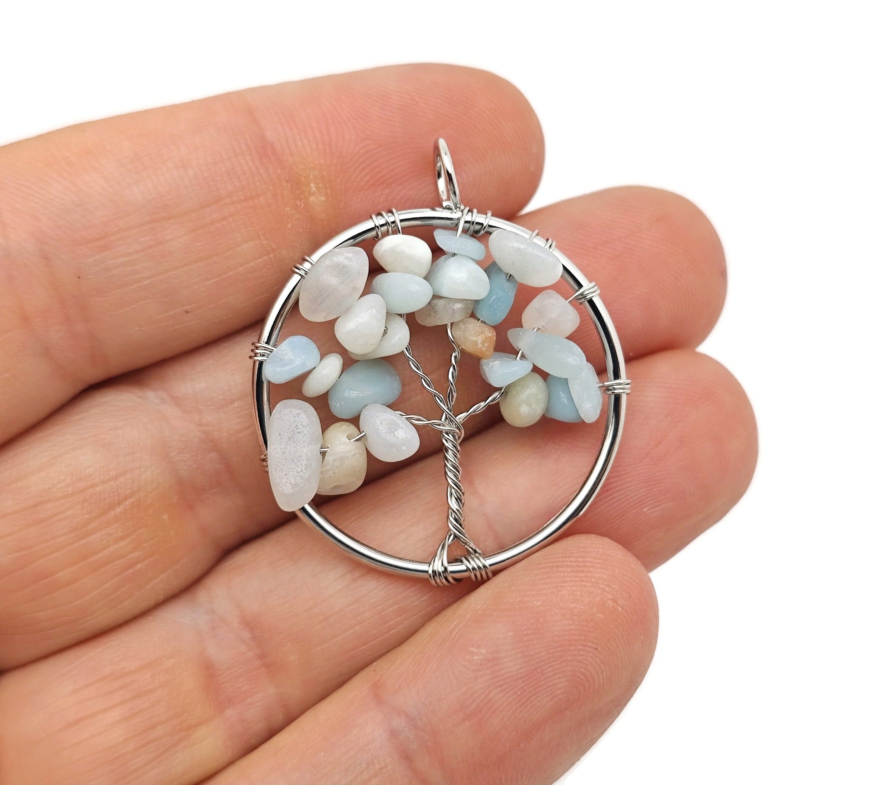 Caribbean calcite Tree of Life gemstone pendant from GemstoneGO featuring vibrant, polished calcite crystals in a detailed tree design.