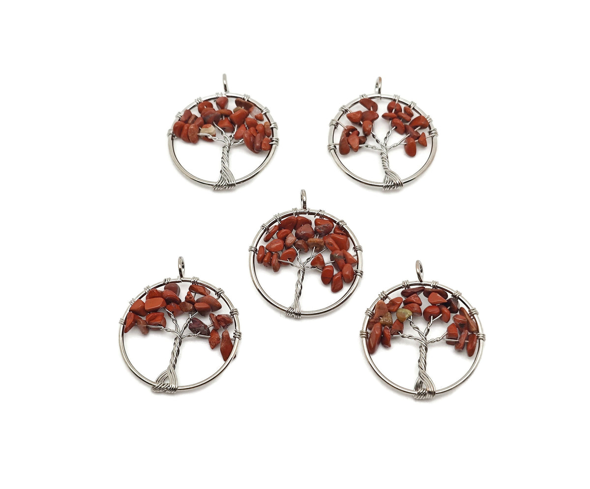 Red Jasper Tree of Life gemstone pendant from GemstoneGO featuring a detailed carved design on a polished red jasper crystal.