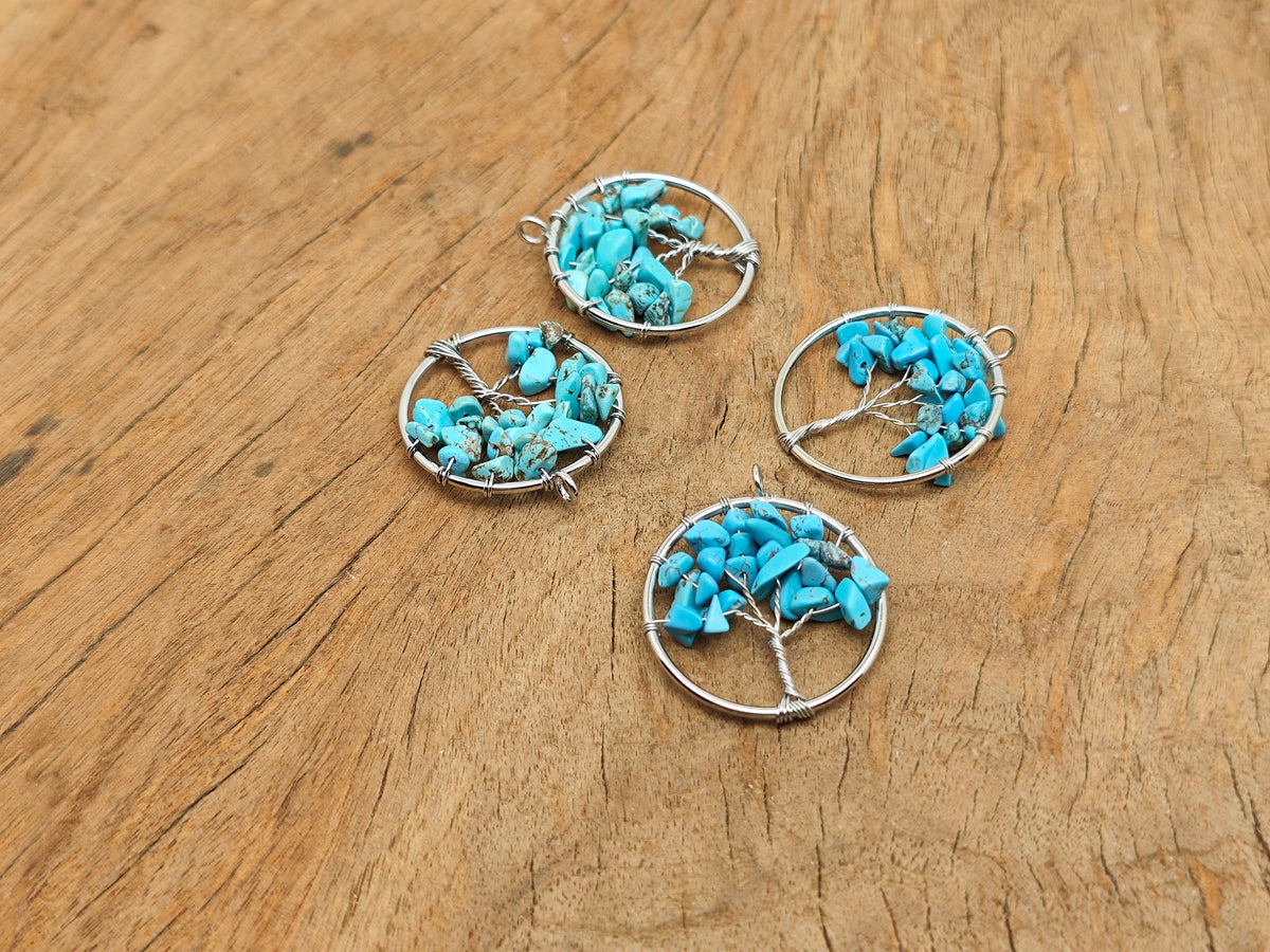 Turquoise Tree of Life gemstone pendant from GemstoneGO featuring a detailed tree design and vibrant blue turquoise stone.