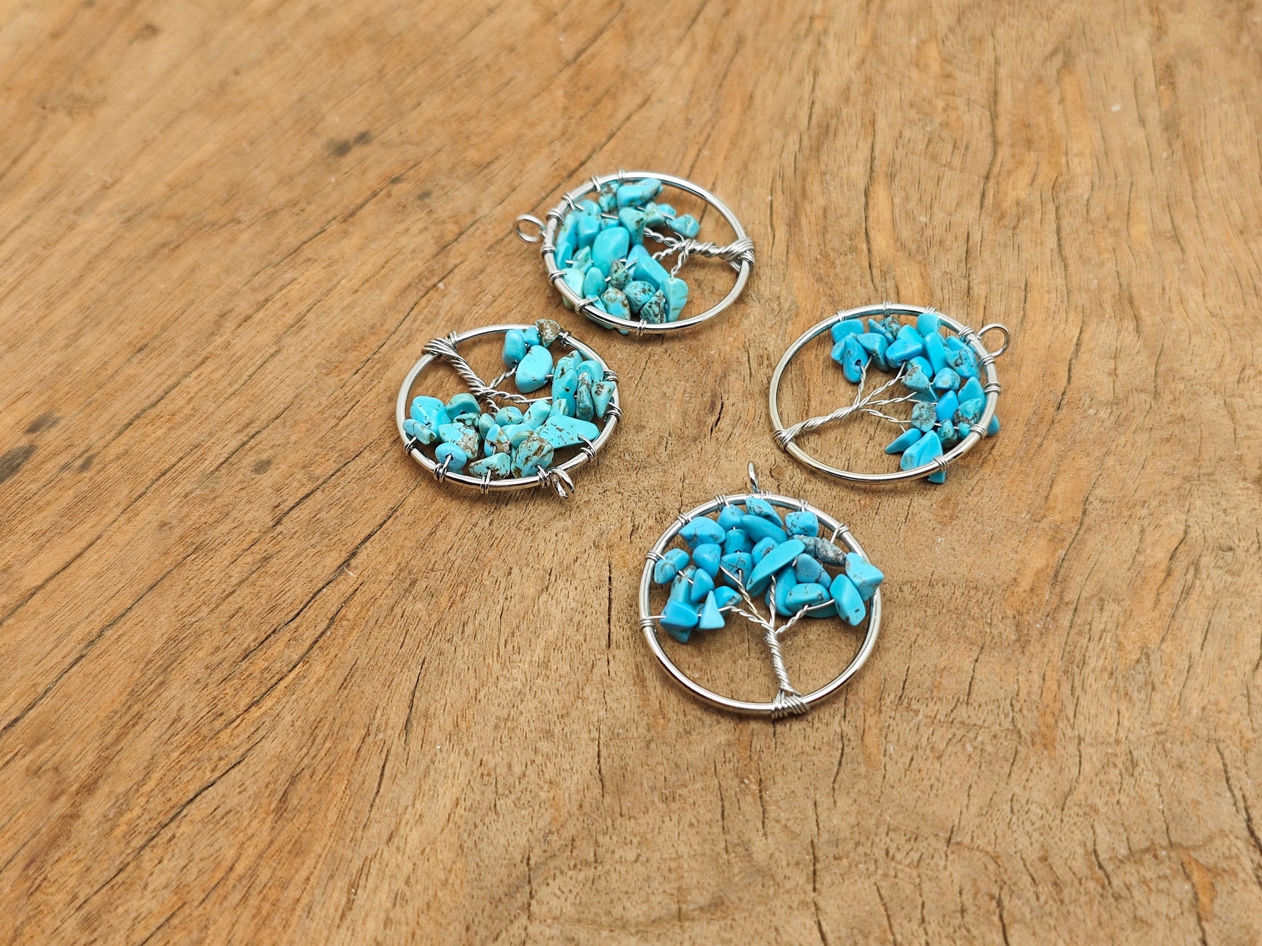 Turquoise Tree of Life gemstone pendant from GemstoneGO featuring a detailed tree design and vibrant blue turquoise stone.