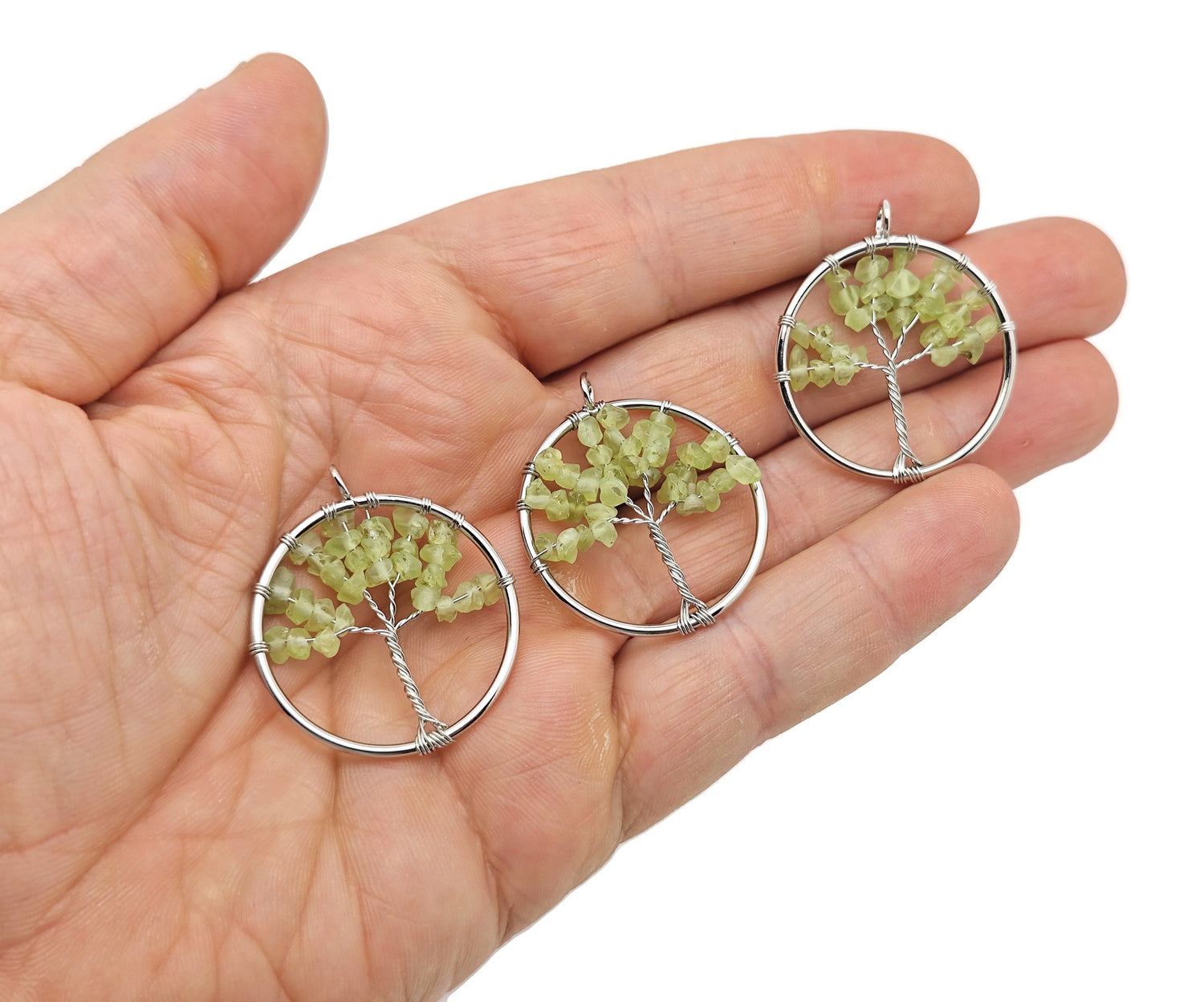 Peridot Olive Tree of Life gemstone pendant from GemstoneGO featuring a detailed tree design with green peridot stones.