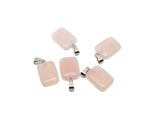 Rose quartz rectangle crystal pendant from GemstoneGO, showcasing a polished pink gemstone with a silver bail for jewelry.