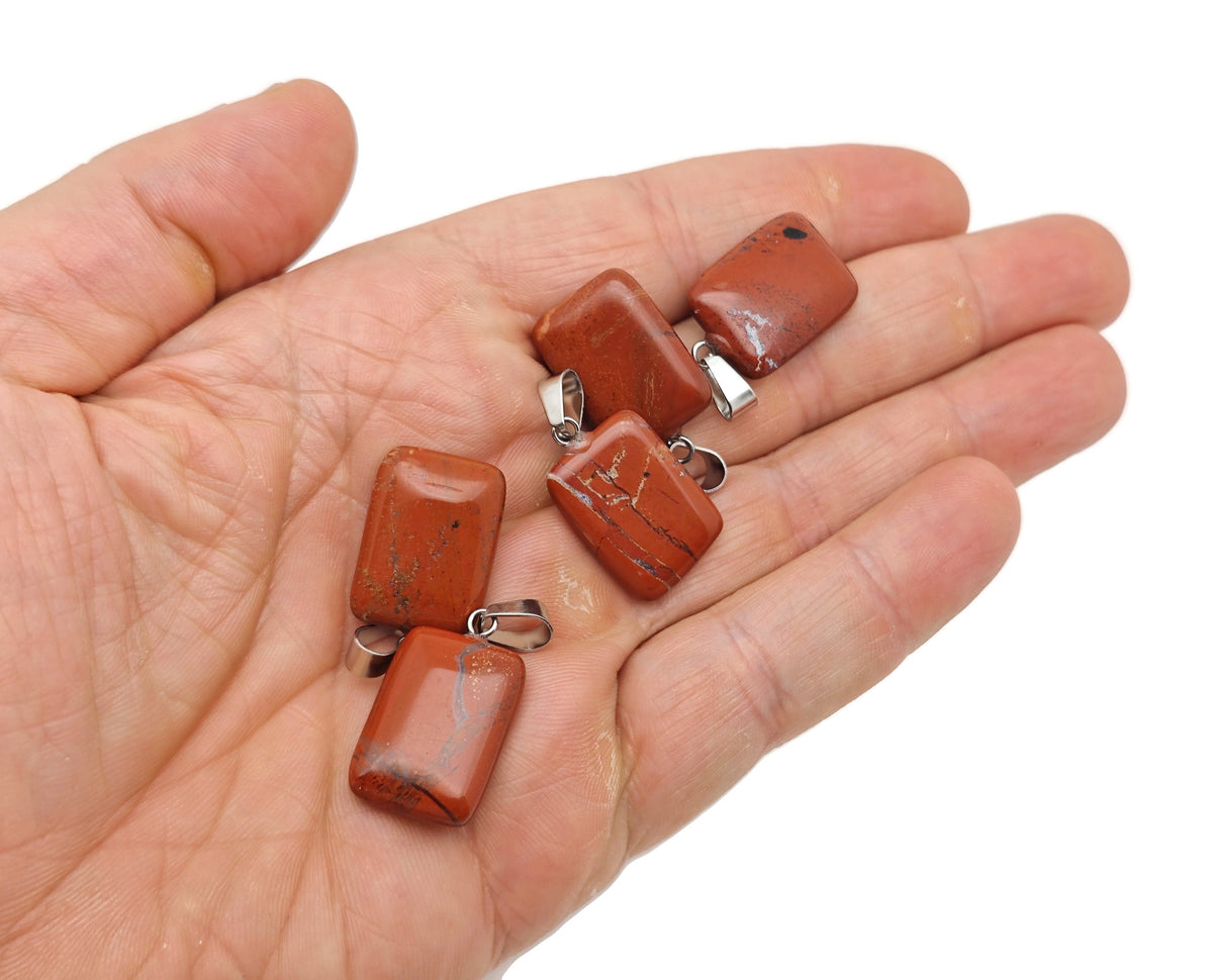 Red Jasper rectangle-shaped crystal pendant from GemstoneGO, showcasing a vibrant polished gemstone with a smooth finish.