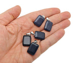 Blue Goldstone rectangle-shaped crystal pendant from GemstoneGO, showcasing a sparkling blue and gold gemstone on a silver setting.