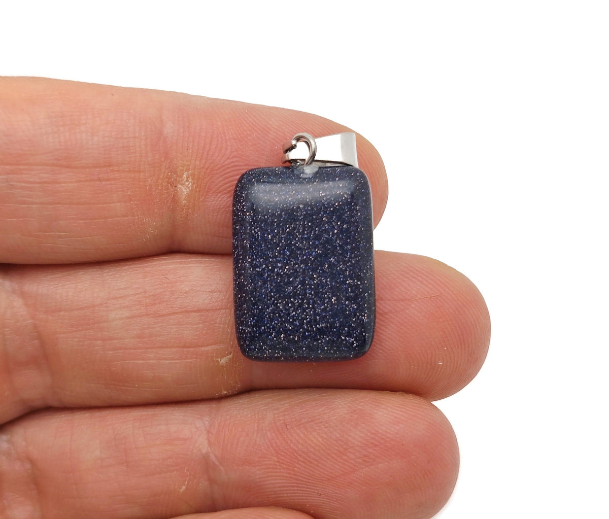 Blue Goldstone rectangle crystal pendant from GemstoneGO, showcasing a shimmering blue and gold gemstone with polished rectangular shape.