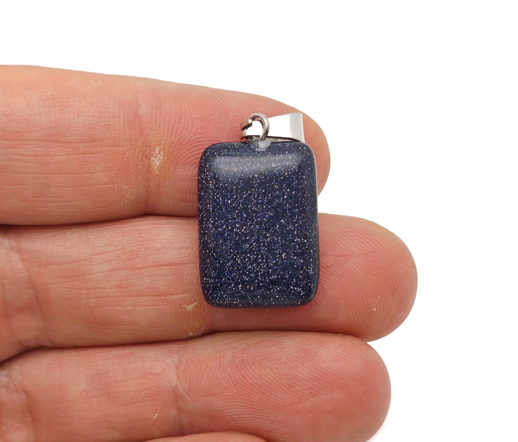 Blue Goldstone rectangle crystal pendant from GemstoneGO, showcasing a shimmering blue and gold gemstone with polished rectangular shape.