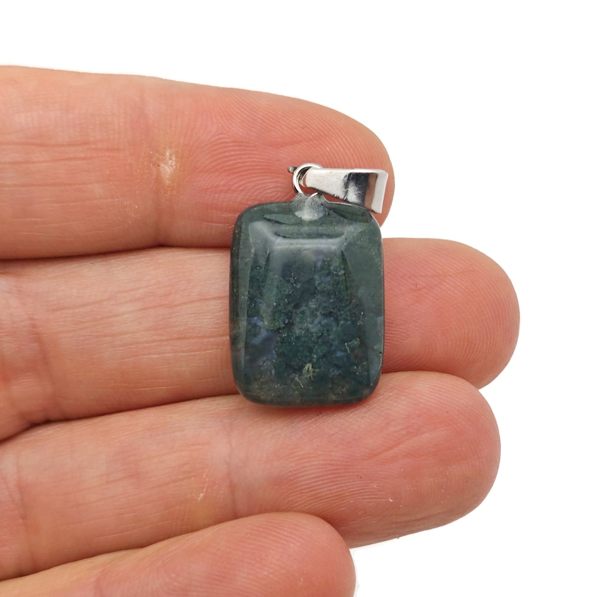 Moss agate rectangle crystal pendant from GemstoneGO, showing polished gemstone with natural green and brown moss patterns.