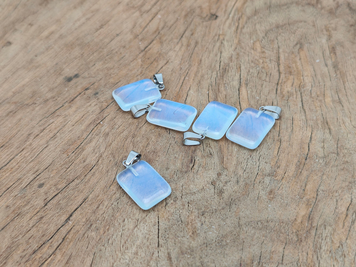 Opalite rectangle-shaped crystal pendant from GemstoneGO, showcasing a smooth, translucent gemstone with subtle iridescent hues.
