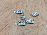 Dalmatian Jasper rectangle crystal pendant from GemstoneGO, showcasing black spots on a beige stone, perfect for jewelry making.