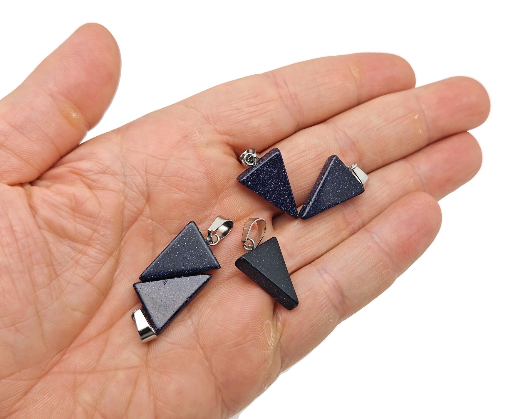 Blue Goldstone triangle-shaped crystal pendant from GemstoneGO, showcasing a vibrant blue and gold speckled design.