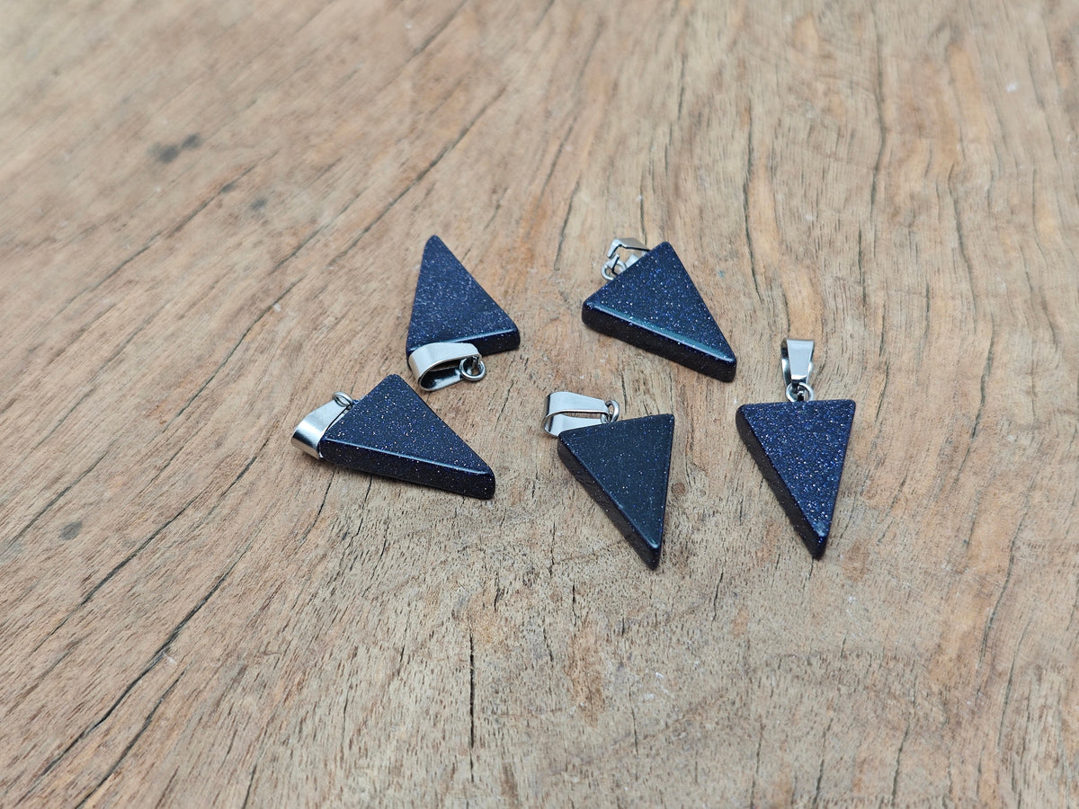 Blue Goldstone triangle-shaped crystal pendant by GemstoneGO, showcasing a sparkling deep blue gemstone with gold flecks.