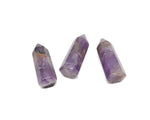 Amethyst obelisk tower crystal from GemstoneGO, 40mm, featuring vibrant purple hues and polished facets.