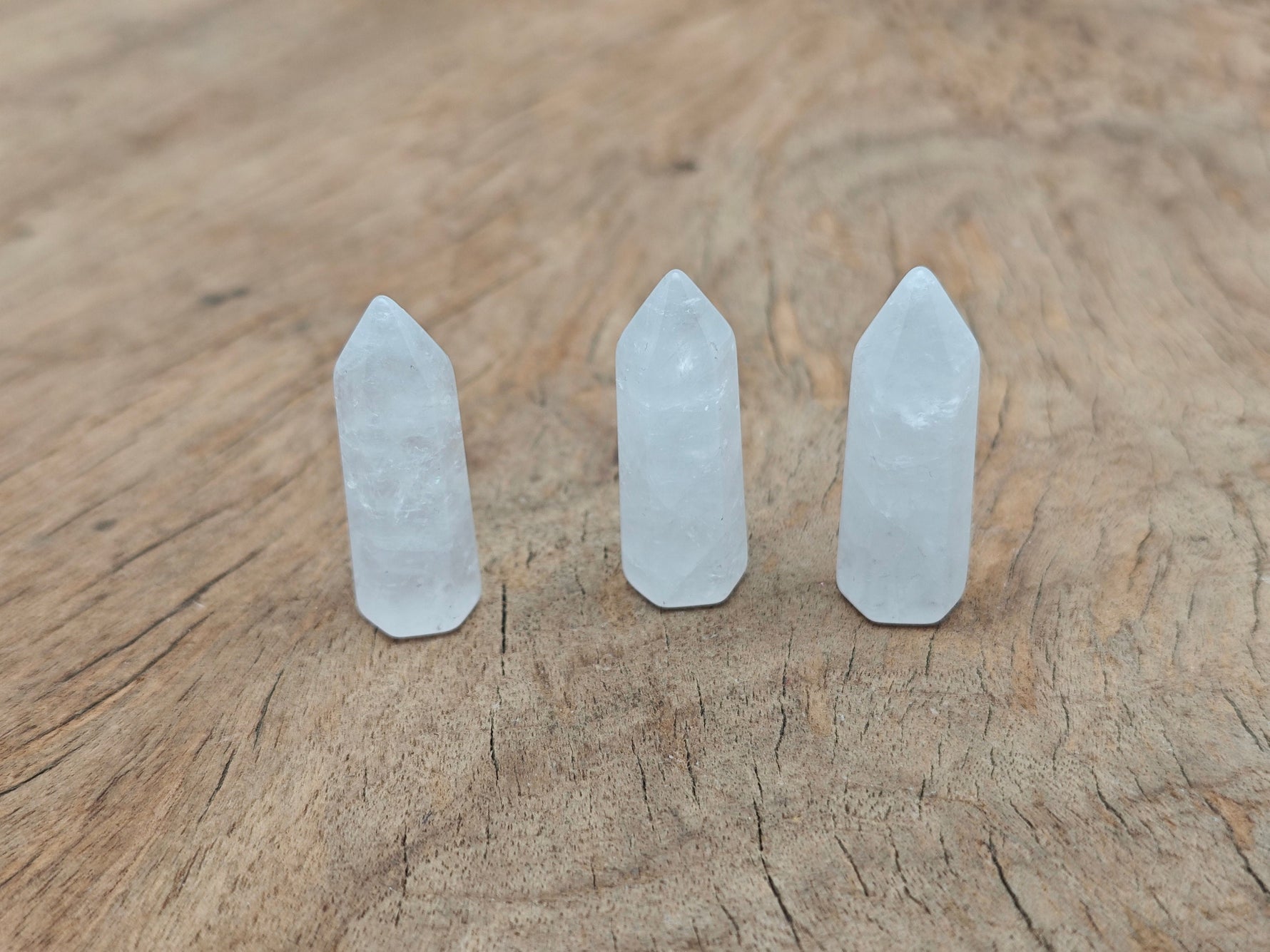 Clear quartz obelisk tower crystal, 40mm, from GemstoneGO, showcasing a polished, pointed gemstone with natural clarity and facets.