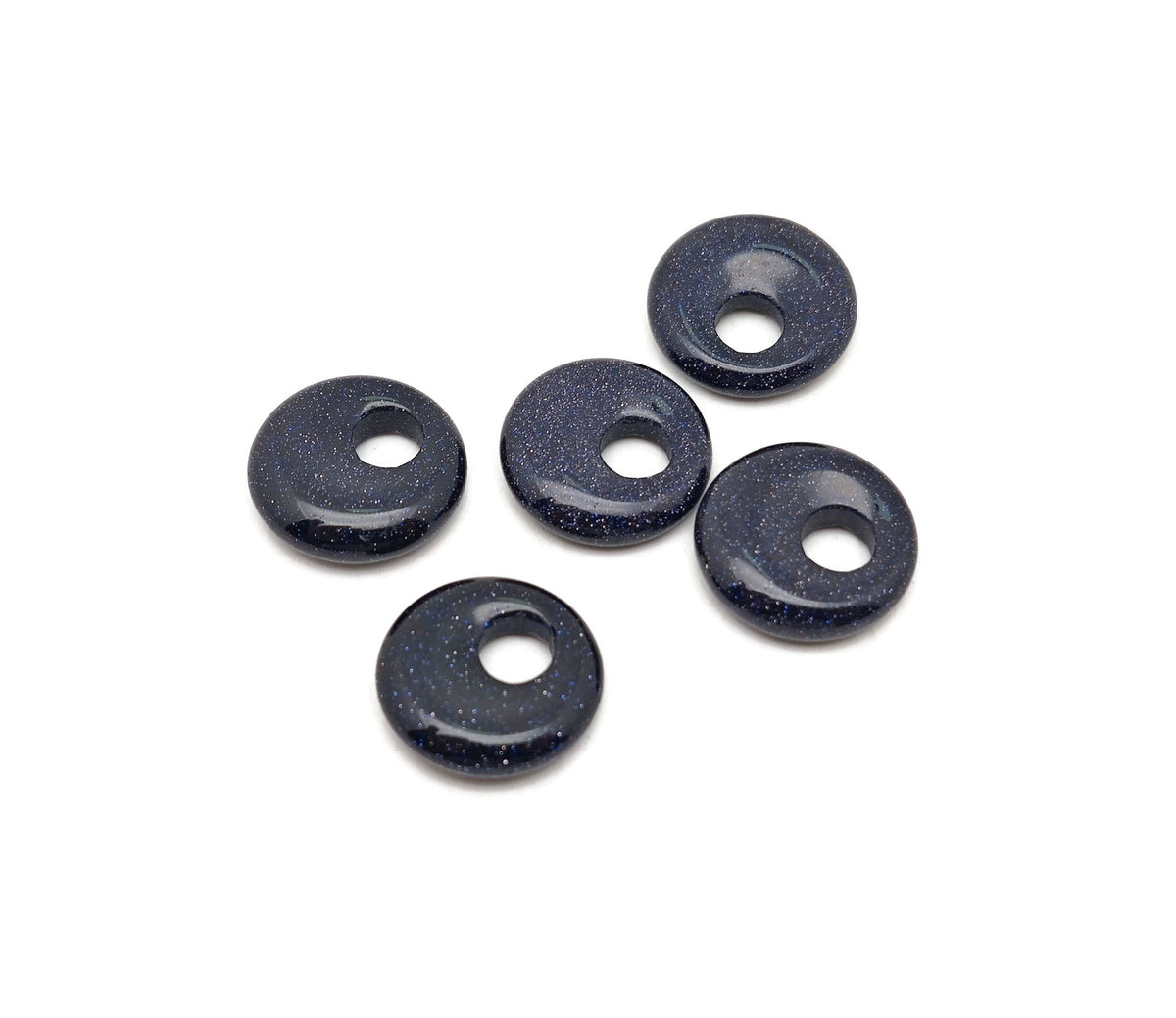 Blue Goldstone crystal donut pendant, 18mm Pi stone from GemstoneGO, showcasing a shimmering blue and gold speckled surface.