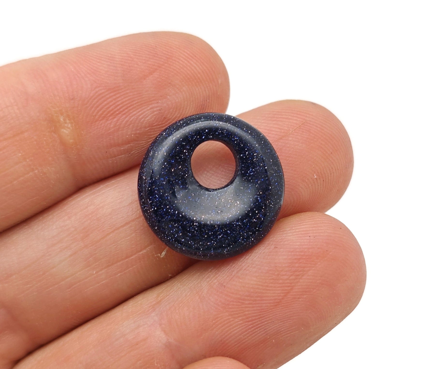 Blue Goldstone crystal donut pendant, 18mm Pi stone from GemstoneGO, featuring a shimmering blue and gold speckled surface.