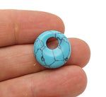 Turquoise crystal donut pendant from GemstoneGO, 18mm Pi Stone with vibrant blue and natural gemstone details.