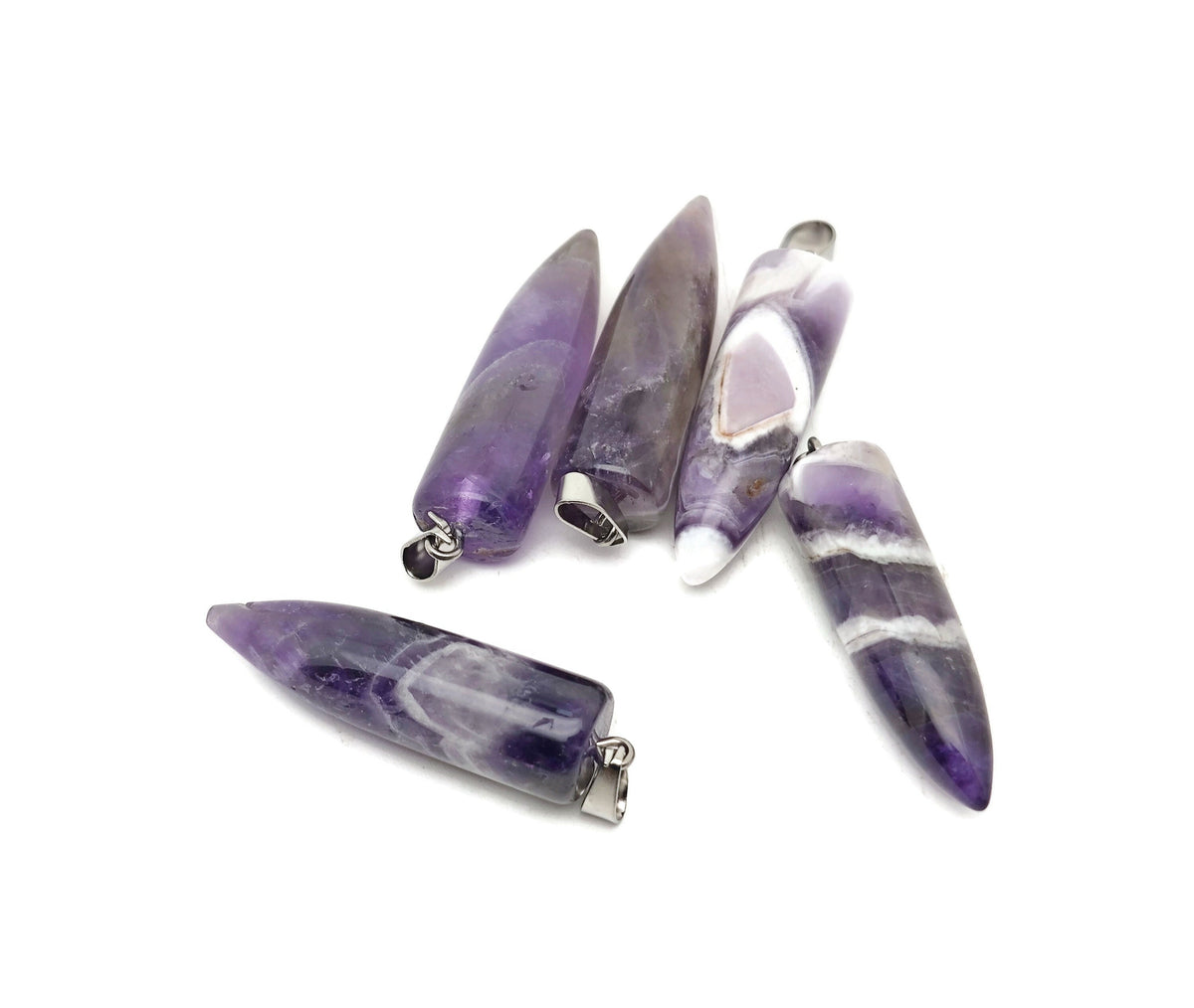 Polished amethyst bullet gemstone pendant with carved details from GemstoneGO, showcasing a smooth, purple, elongated pendant.