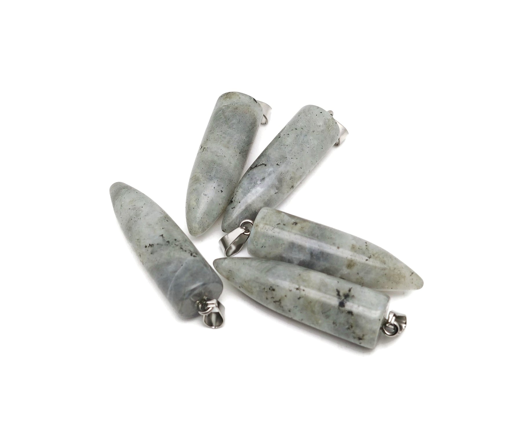 Polished Labradorite bullet gemstone pendant with carved details, showcasing iridescent blue and green hues on a smooth, polished surface.