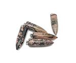 Polished Rhodonite bullet gemstone pendant with carved details, showcasing vibrant pink and black stone on a simple cord.