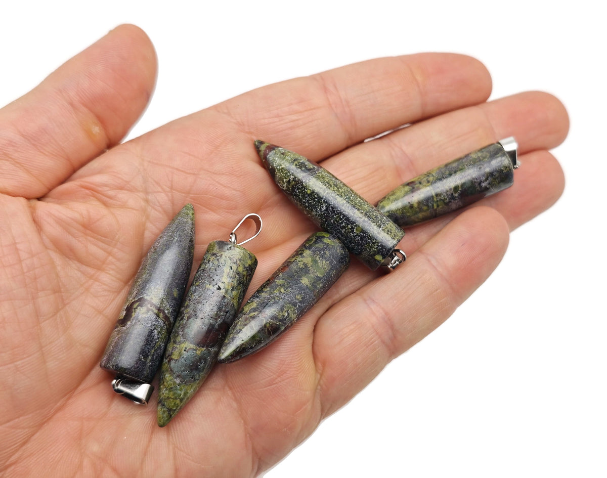 Polished Dragon Blood Jasper bullet gemstone pendant with carved details, featuring rich red and brown hues, from GemstoneGO.