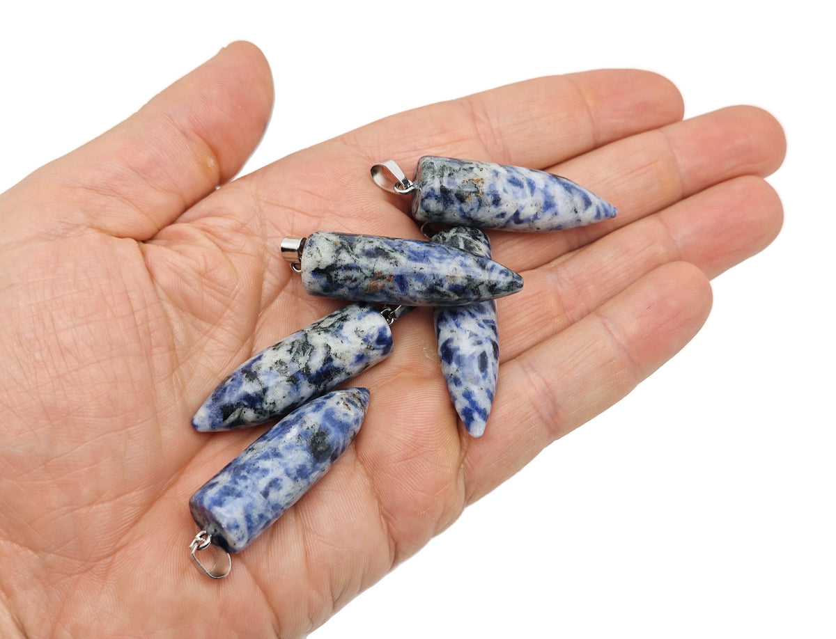 Polished bullet-shaped gemstone pendant by GemstoneGO featuring carved crystal healing mineral, with vibrant mixed gemstone colors.