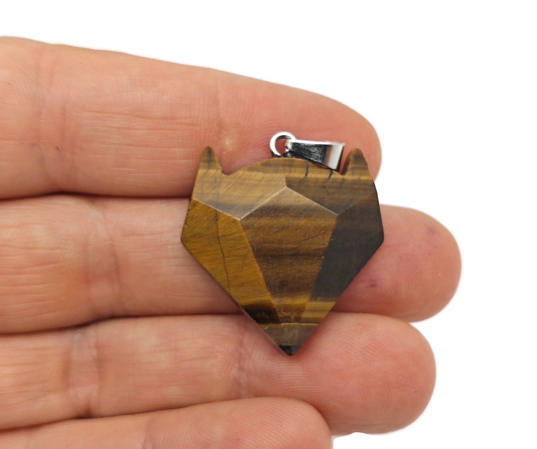 Tiger Eye wolf head gemstone pendant, featuring detailed crystal jewelry design with natural stone and intricate craftsmanship.