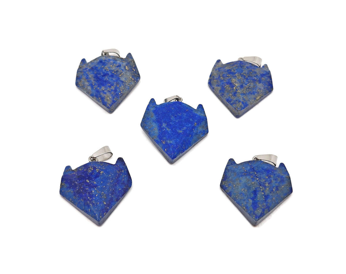 Lapis Lazuli wolf head gemstone pendant from GemstoneGO with intricate details and vibrant blue color on a silver chain.