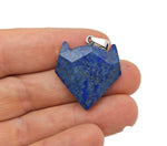 Lapis Lazuli wolf head gemstone pendant with detailed carving, silver bail, and vibrant blue color, ideal for crystal jewelry collection.