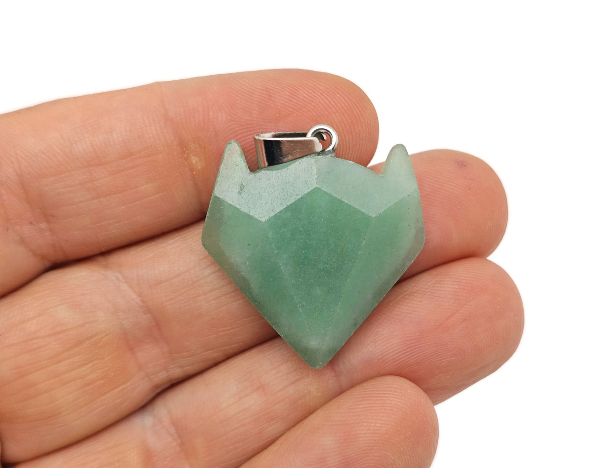 Aventurine gemstone wolf head pendant from GemstoneGO, featuring detailed crystal jewelry design.