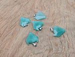 Aventurine wolf head gemstone pendant from GemstoneGO, featuring detailed carved crystal jewelry with a natural green hue.