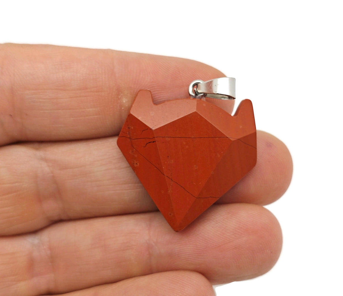 Red Jasper wolf head gemstone pendant from GemstoneGO, featuring detailed wolf design in vibrant red jasper crystal jewelry.