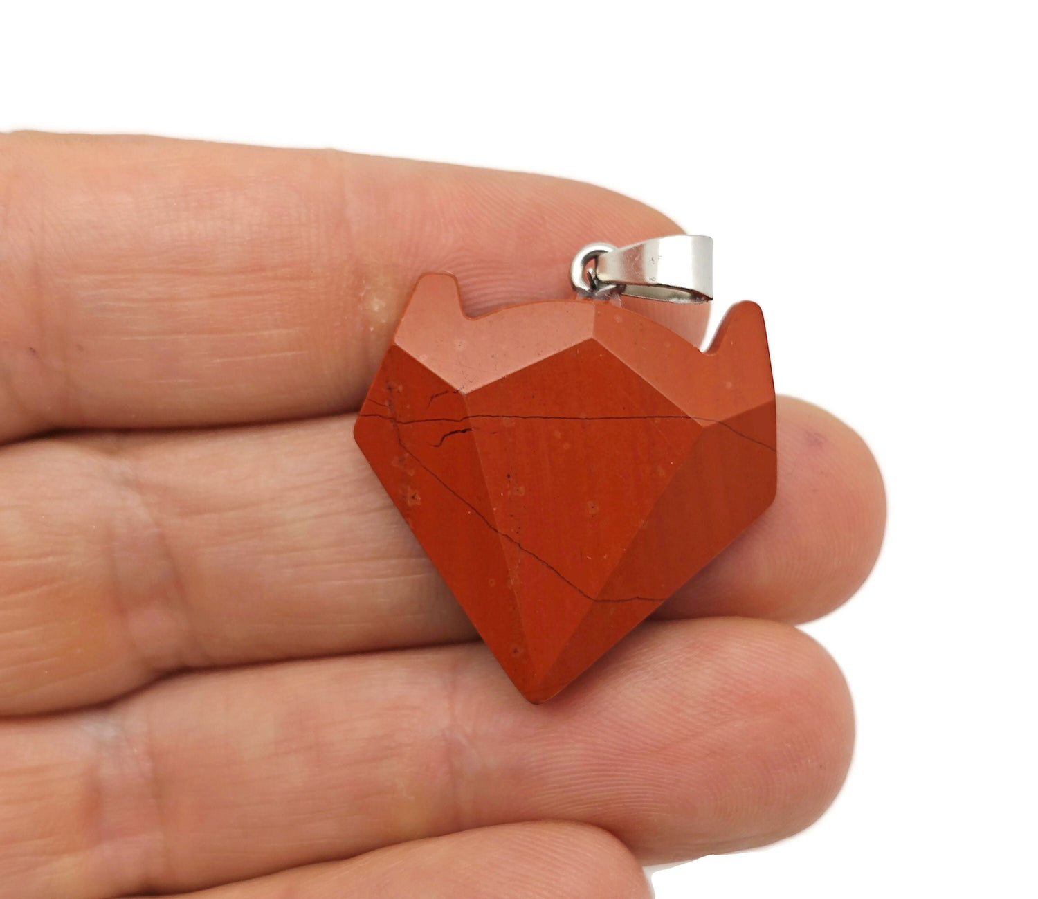 Red Jasper wolf head gemstone pendant from GemstoneGO, featuring detailed wolf design in vibrant red jasper crystal jewelry.