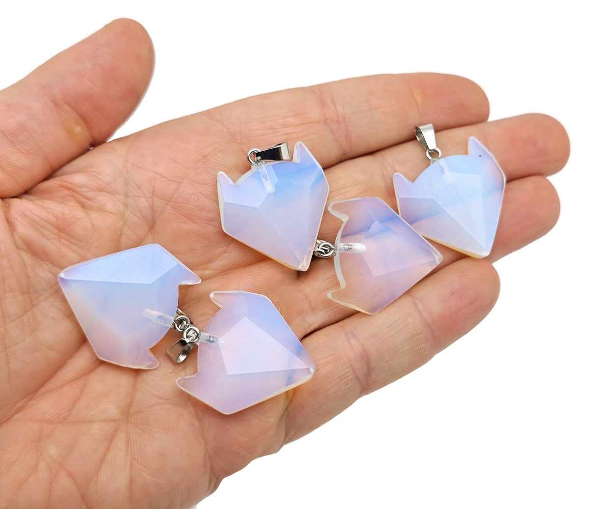 Opalite wolf head gemstone pendant from GemstoneGO, featuring a detailed wolf design with polished opalite stone for jewelry.