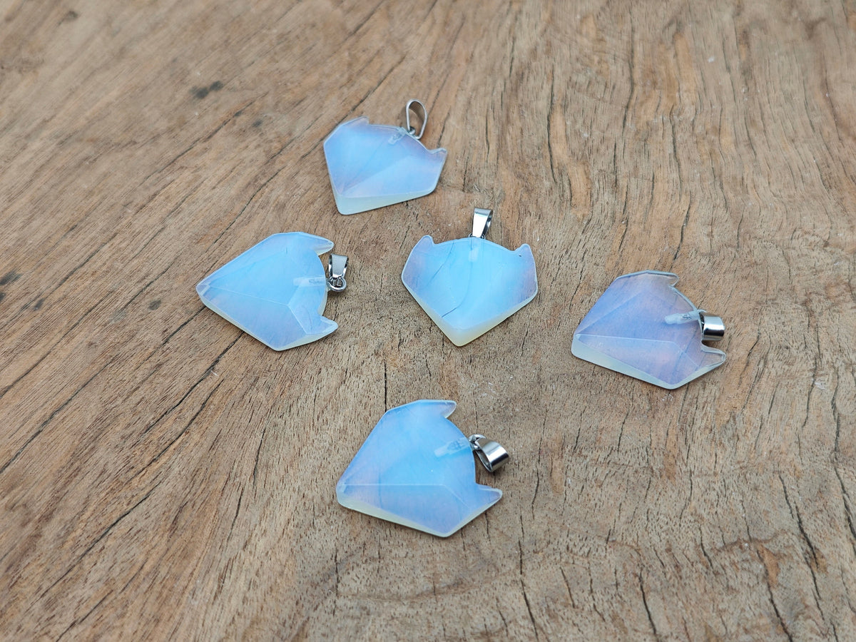 Opalite gemstone wolf head pendant from GemstoneGO, featuring a detailed wolf design and polished gemstone for crystal jewelry.