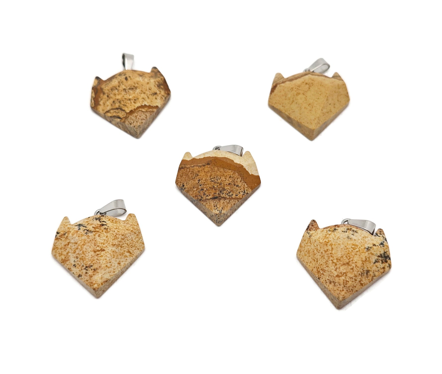 Picture Jasper wolf head pendant from GemstoneGO featuring a carved gemstone wolf's head in earthy tones for jewelry.