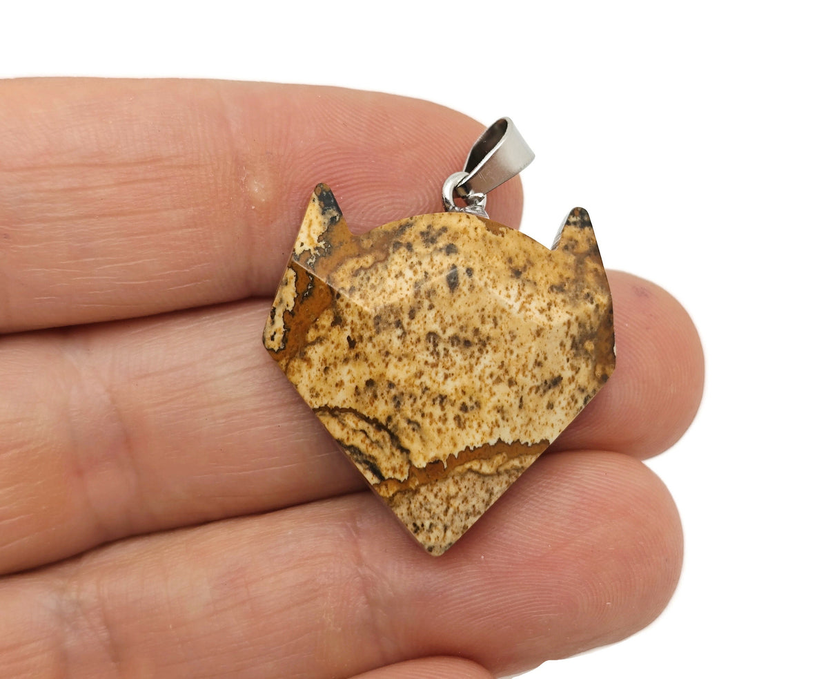 Picture Jasper wolf head gemstone pendant featuring natural crystal jewelry with detailed wolf design by GemstoneGO.
